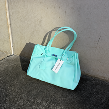 Aqua Sencieres large jelly Firkin bag, glossy translucent TPU handbag — styled outfit look