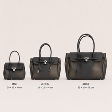 Black Sencieres jelly Firkin bag, glossy translucent TPU handbag — worn over the shoulder