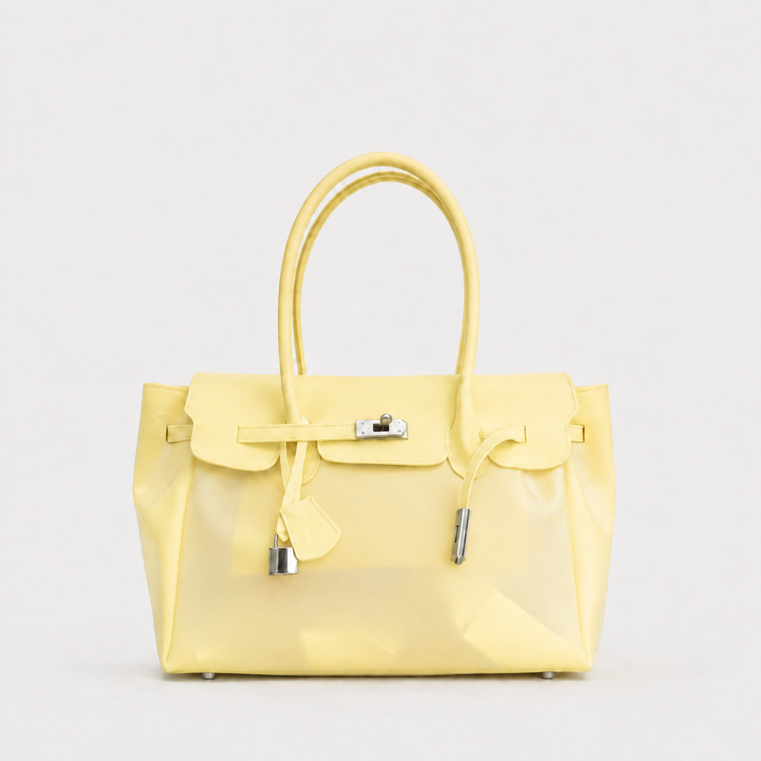 Yellow Sencieres jelly Firkin bag, glossy translucent TPU handbag — front view