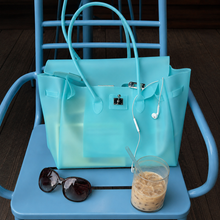 Aqua Sencieres large jelly Firkin bag, glossy translucent TPU handbag — worn over the shoulder