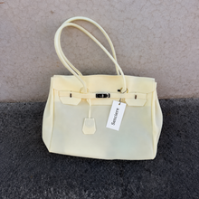 Yellow Sencieres jelly Firkin bag, glossy translucent TPU handbag — styled outfit look
