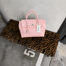 Pink Sencieres jelly Firkin bag, glossy translucent TPU handbag — close-up of the turn-lock detail