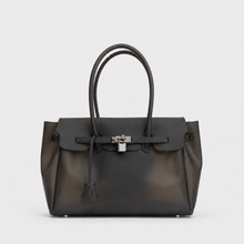 Black Sencieres jelly Firkin bag, glossy translucent TPU handbag — front view